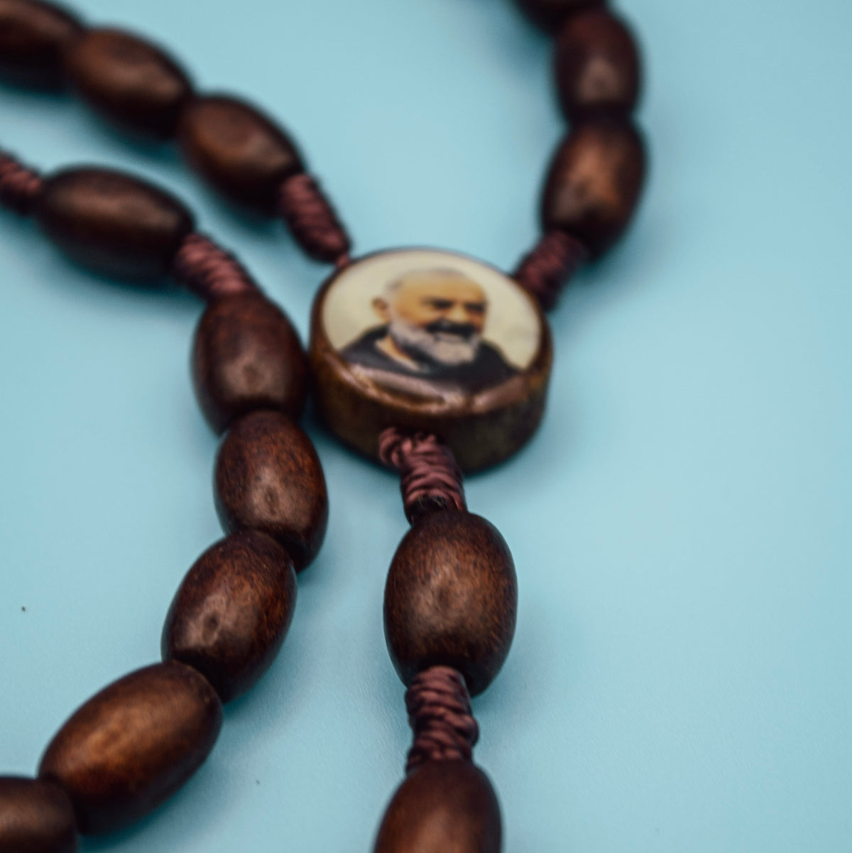 Padre Pio centerpiece with oval wooden Rosary beads