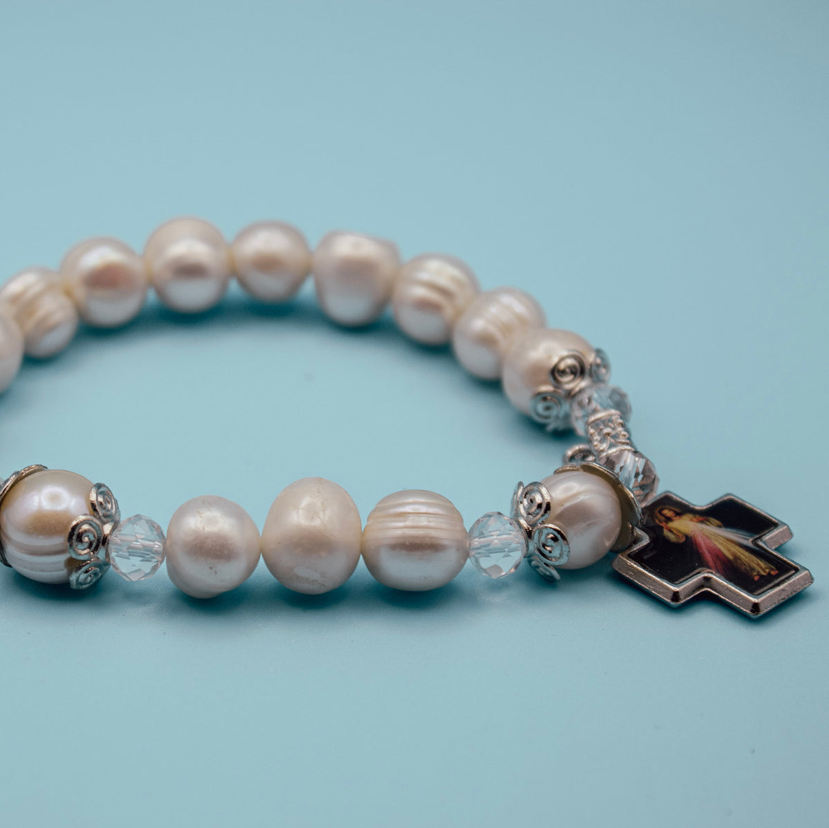 Divine Mercy devotional cross on pearl-style rosary bracelet