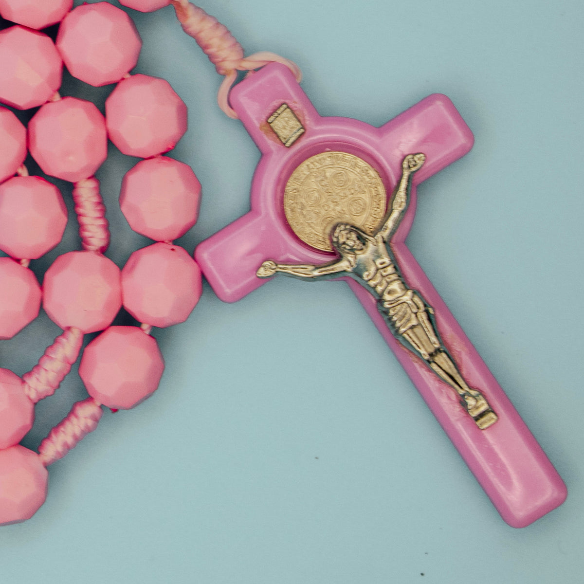 Saint Benedict crucifix on pink five-decade Rosary