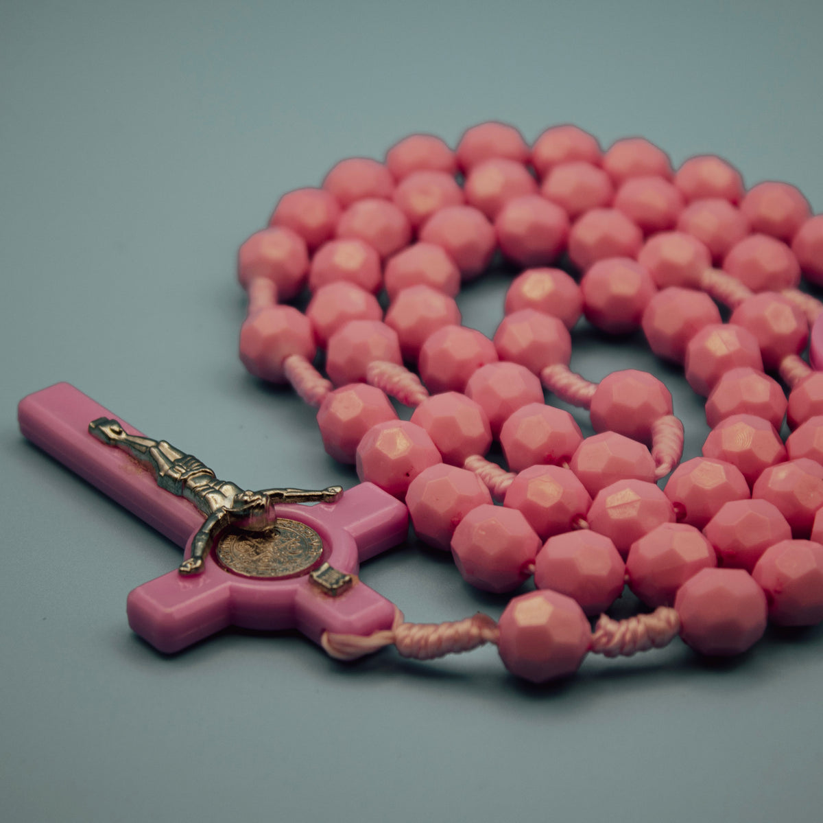 Pink faceted Saint Benedict Rosary with medal centerpiece